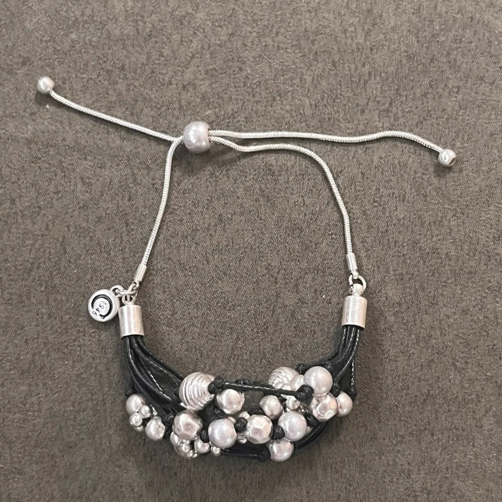 C1946 Silvertone bead and black cord adjustable bracelet